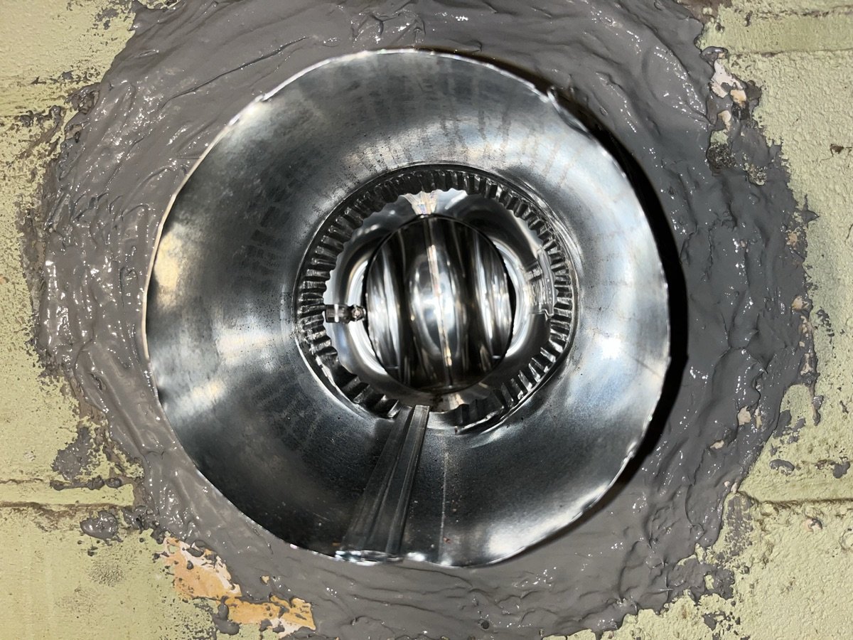 Blocked chimney flue with bird nest causing draft issues